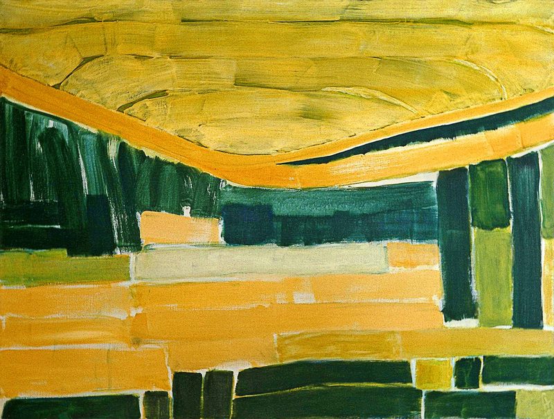 Abstract print above a small desk